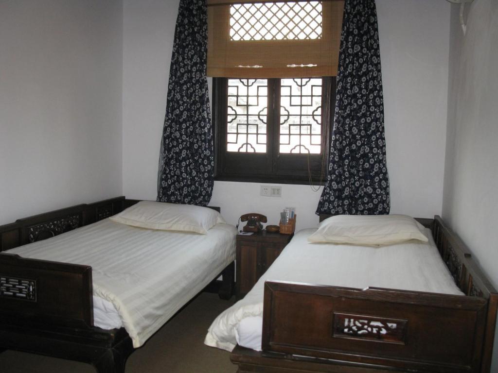 XI Di Travel Lodge Yi (Anhui) Phòng bức ảnh